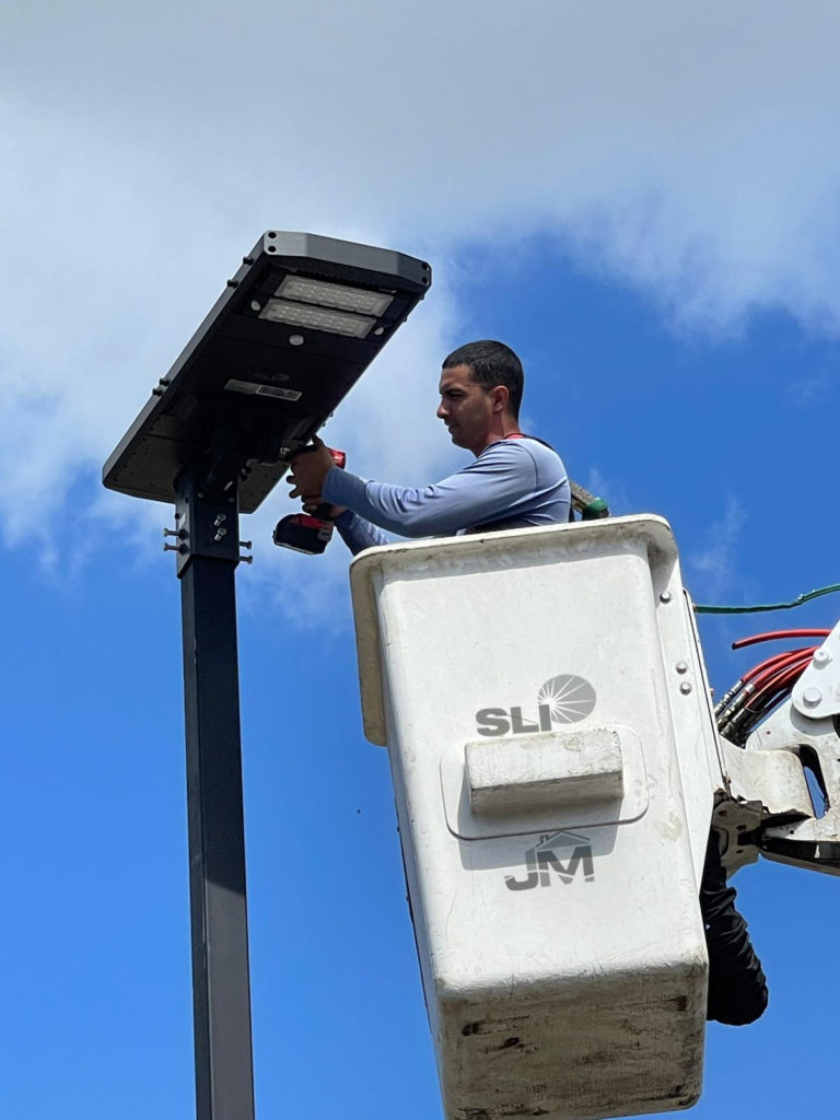 Solar lights being installed at a hospital facility