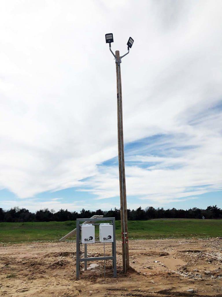 wood pole solar lights installed at Signal Peak Silica in Oklahoma, providing efficient lighting upgrade solutions.