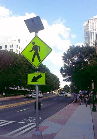 solar-pedestrian-crosswalk-2-210x300 A street with solar powered pedestrian crosswalk signs